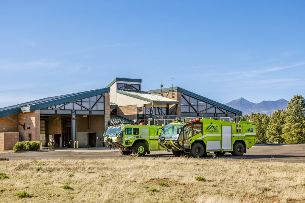 Two ARFF trucks parked outside the FLG Airport fire station